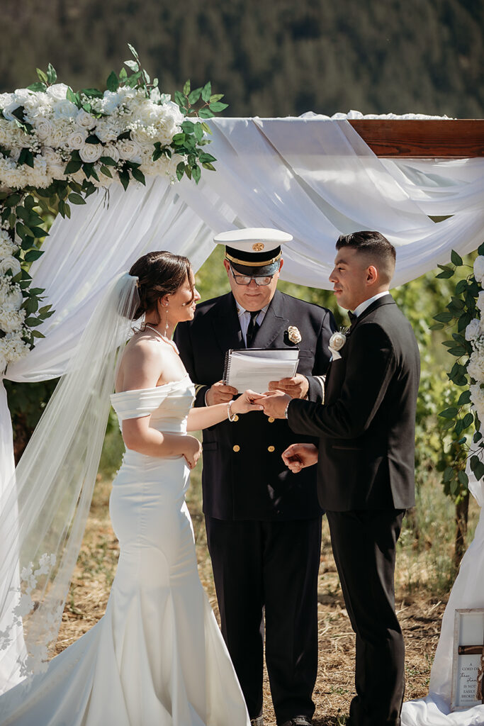 Couple exchanging vows overlooking vineyard rows in Calistoga | Napa Wedding Photographer