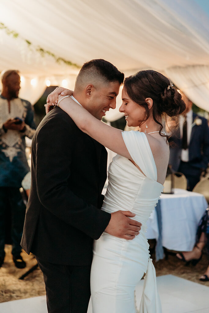Bride and groom dancing under the stars at Napa Valley vineyard wedding
